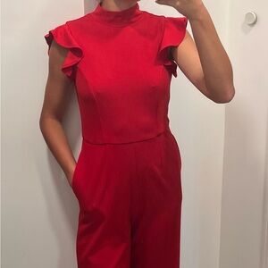 Red turtle neck jump suit